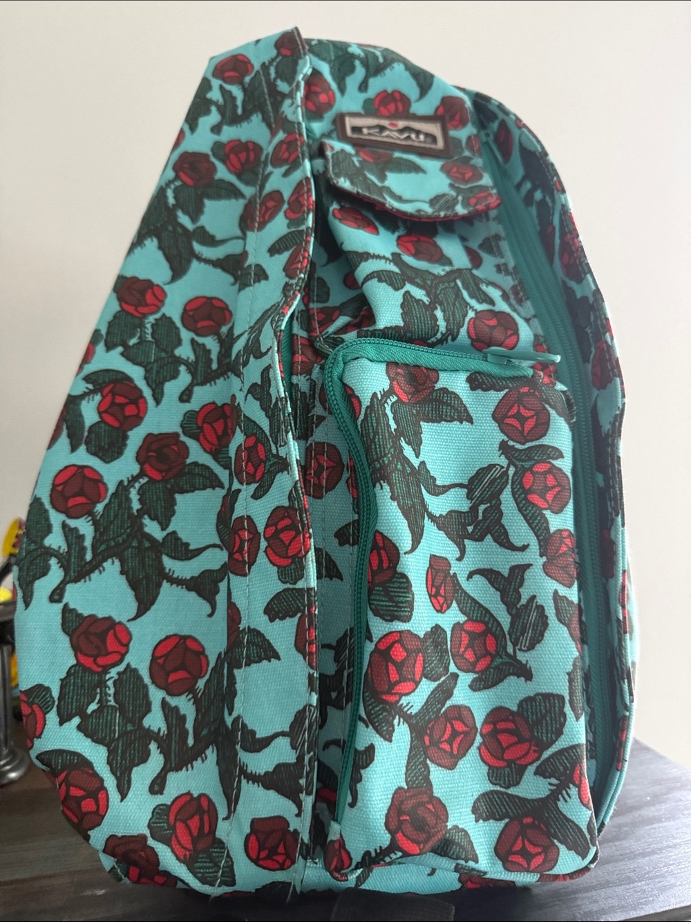 Kavu Turquoise Floral Sling Backpack with Red Rose Print